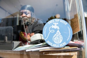 A Refill campaign sticker in the window of Cafe Kino in Stokes Croft, Bristol