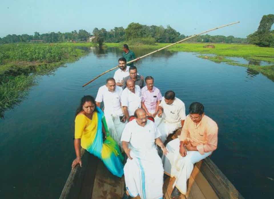 State PWD minister G Sudhakaran (in Centre) and others taking a boat ride on the Kuttemperoor river after it was revived. 